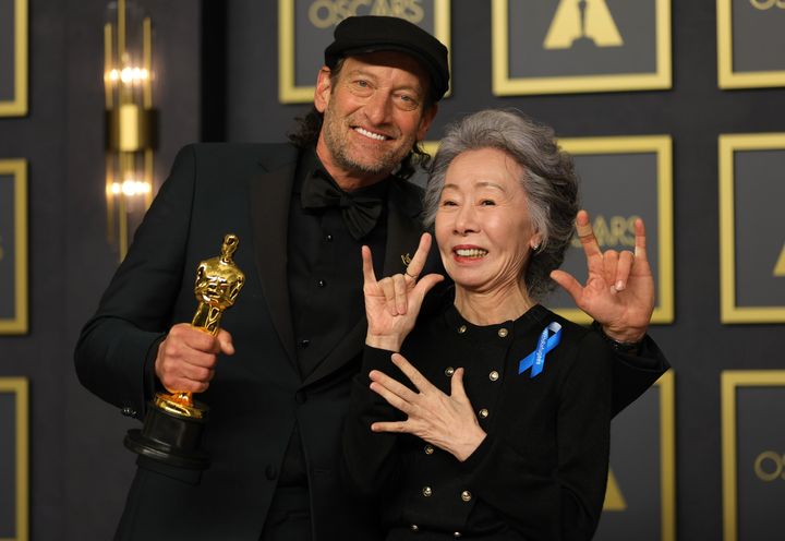 Troy Kotsur, winner of the Actor in a Supporting Role award for "CODA," and presenter Youn Yuh-jung pose in the press room during the 94th Annual Academy Awards on March 27.