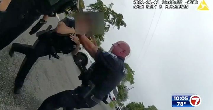 Sunrise police Sgt. Christopher Pullease chokes a female junior officer who intervened after the sergeant grew increasingly aggressive with a handcuffed suspect on Nov. 19, 2021. The police department released body camera footage with sound Monday after WSVN 7 News obtained the audio.