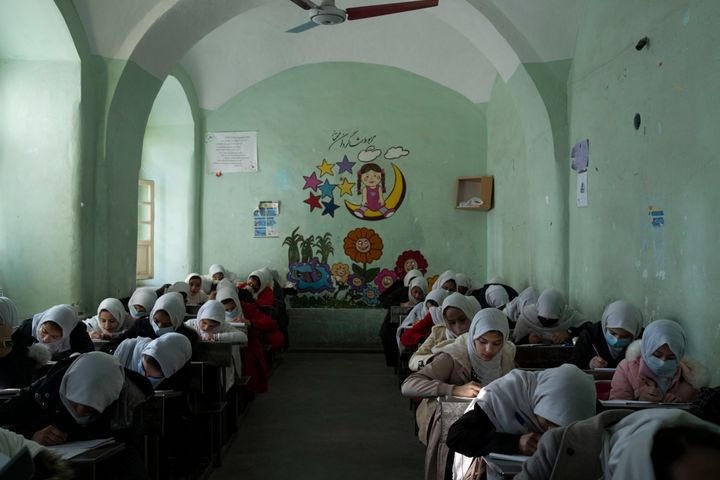 Afghan girls participate a lesson inside a classroom at Tajrobawai Girls High School, in Herat, Afghanistan, on Nov. 25, 2021.