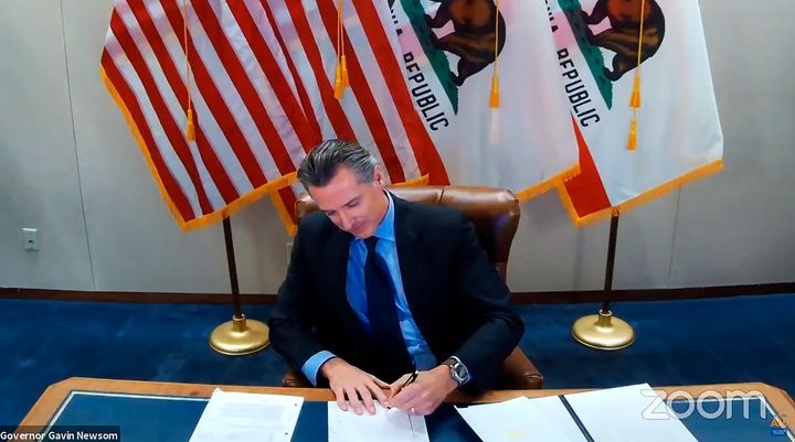 This Image Made From Video Of The Governor'S Office Shows California Governor Gavin Newsom Signing A Bill Setting Up A Task Force To Come Up With Recommendations On How To Compensate Black Americans On September 30, 2020, In Sacramento, California.