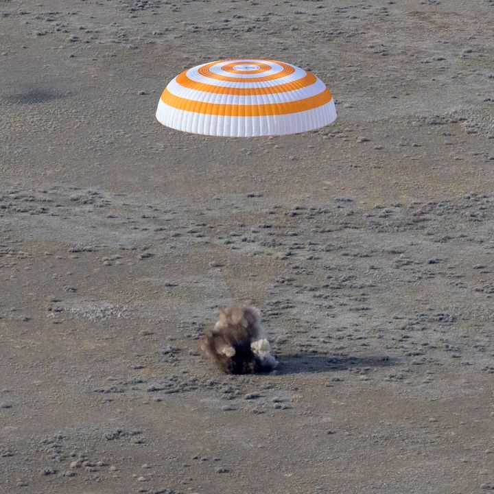 The Soyuz MS-19 spacecraft is seen as it lands in a remote area near the town of Zhezkazgan, Kazakhstan.