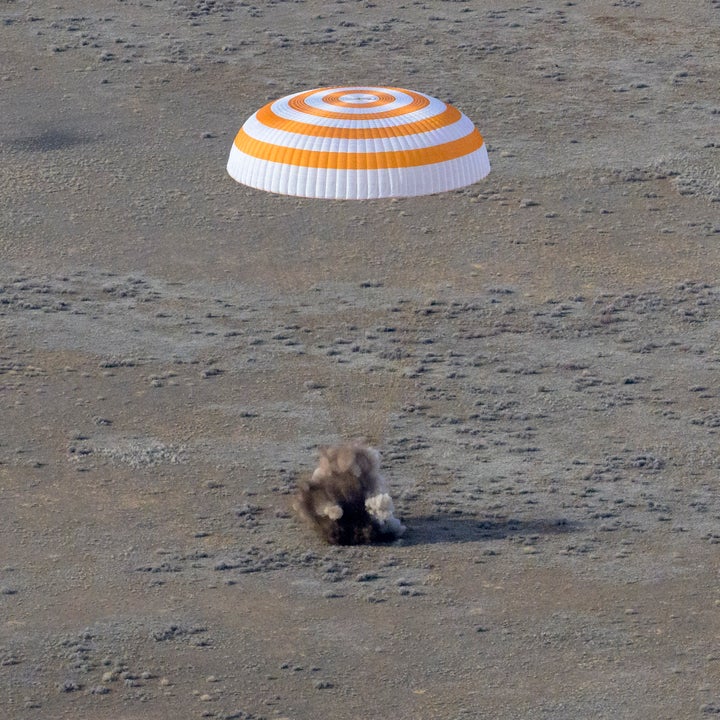 The Soyuz MS-19 spacecraft is seen as it lands in a remote area near the town of Zhezkazgan, Kazakhstan.