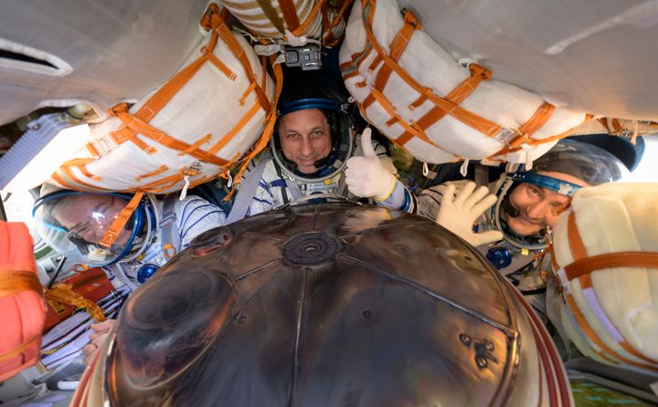 Expedition 66 crew members (L-R) Mark Vande Hei of NASA, cosmonauts Anton Shkaplerov and Pyotr Dubrov of Roscosmos, are seen inside their Soyuz MS-19 spacecraft after it landed.