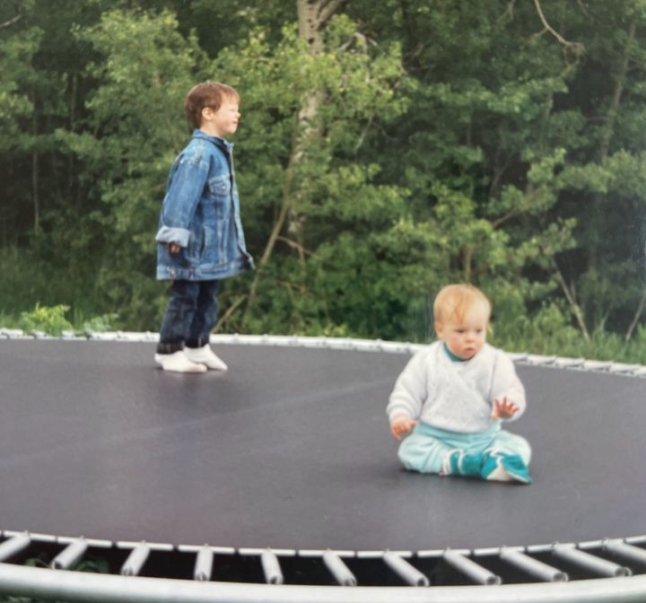 The author (right) and Dave bouncing on a trampoline in Montana in 1994.