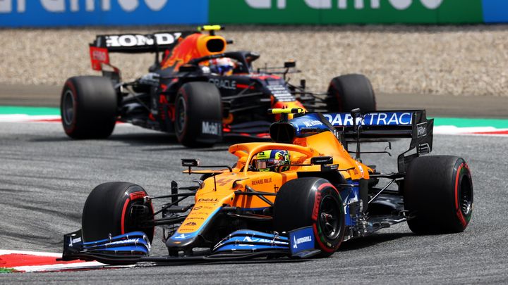 SPIELBERG, AUSTRIA - JUNE 27: Lando Norris of Great Britain driving the (4) McLaren F1 Team MCL35M Mercedes leads Sergio Perez of Mexico driving the (11) Red Bull Racing RB16B Honda during the F1 Grand Prix of Styria at Red Bull Ring on June 27, 2021 in Spielberg, Austria. (Photo by Clive Mason - Formula 1/Formula 1 via Getty Images)