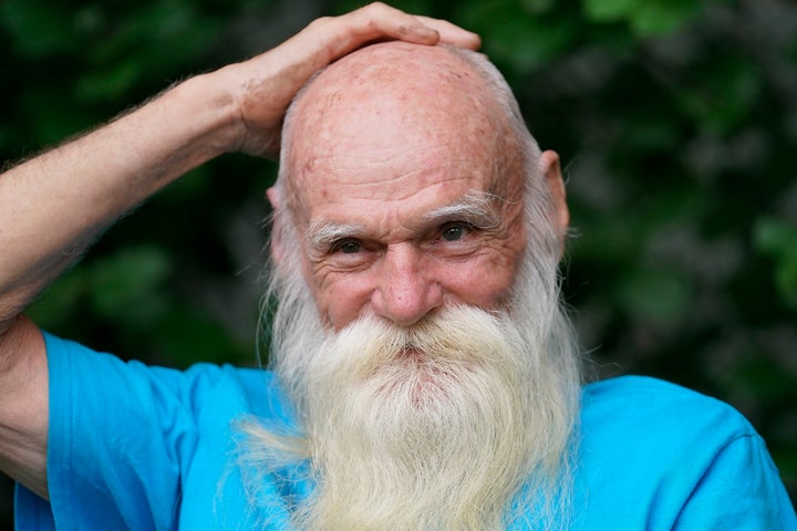 FILE — David Lidstone, 81, speaks with reporters during an interview with The Associated Press Tuesday, Aug. 10, 2021, in Boscawen, N.H. Lidstone, an off-the-grid New Hampshire hermit known to locals as "River Dave," had been living in a cabin in the woods along the Merrimack River, in Canterbury, N.H., for nearly three decades. A contempt of court hearing has been scheduled for Thursday, March 31, 2022, for Lidstone, accused of returning to live on property that he was ordered to stay away from. (AP Photo/Steven Senne, File)