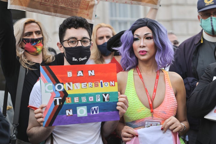 A group of LGBT+ supporters gathering in front of the Cabinet Office to protest the use of conversion therapy.