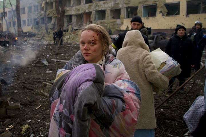 Mariana Vishegirskaya stands outside a maternity hospital that was damaged by shelling in Mariupol, Ukraine, on March 9. Vishegirskaya was taken to another nearby hospital where she gave birth the following day to a baby girl.