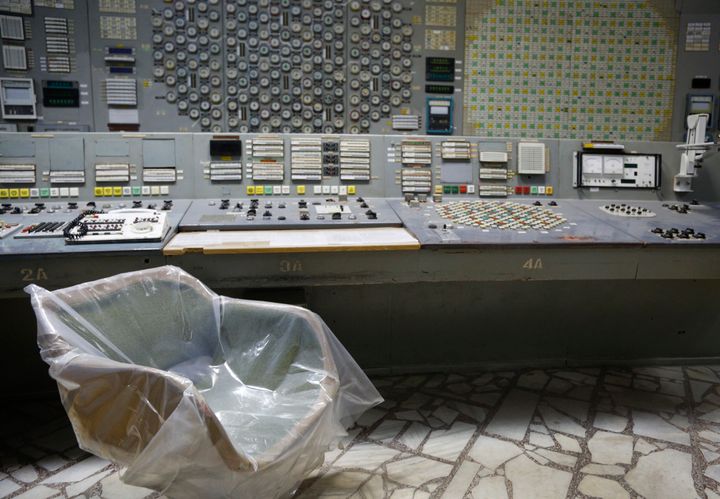 An operator's armchair covered with plastic sits in an empty control room of the third reactor at the Chernobyl nuclear plant in 2018.