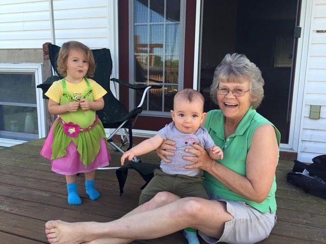 The author's two oldest children, 1 and 3, with her mom in 2015.