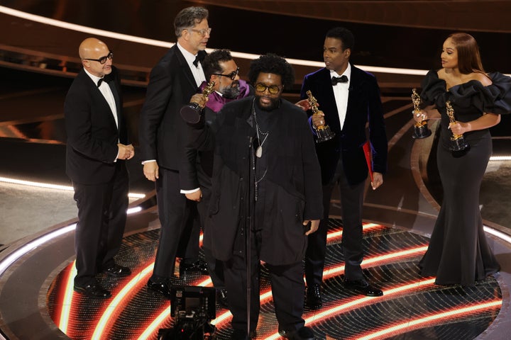 Ahmir "Questlove" Thompson accept the documentary feature award for "Summer of Soul (...Or, When the Revolution Could Not Be Televised)" from Chris Rock onstage during the 94th Annual Academy Awards on March 27 in Los Angeles.