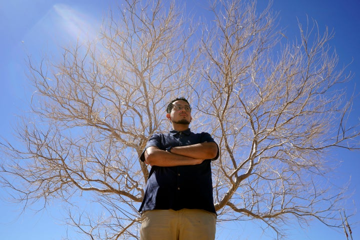 Benito Luna, a 7th-grade social studies teacher at California City Middle School, poses for a photo outside the California City Middle School in California City, Calif., on March 11, 2022.