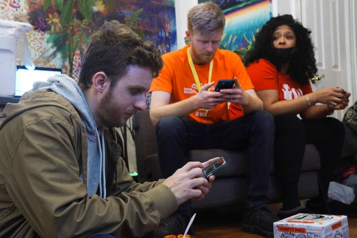 Connor Spence, left, watching the election vote count with fellow organizers Angelika Maldonado and Brett Daniels last week. The Amazon Labor Union won the election 2,654 to 2,131.