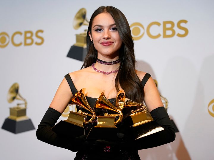 Olivia Rodrigo, winner of the awards for Best Pop Vocal Album for "Sour," Best New Artist and Best Pop Solo Performance for "Drivers License," poses in the press room at the 64th Annual Grammy Awards at the MGM Grand Garden Arena on Sunday, April 3, 2022, in Las Vegas. (AP Photo/John Locher)