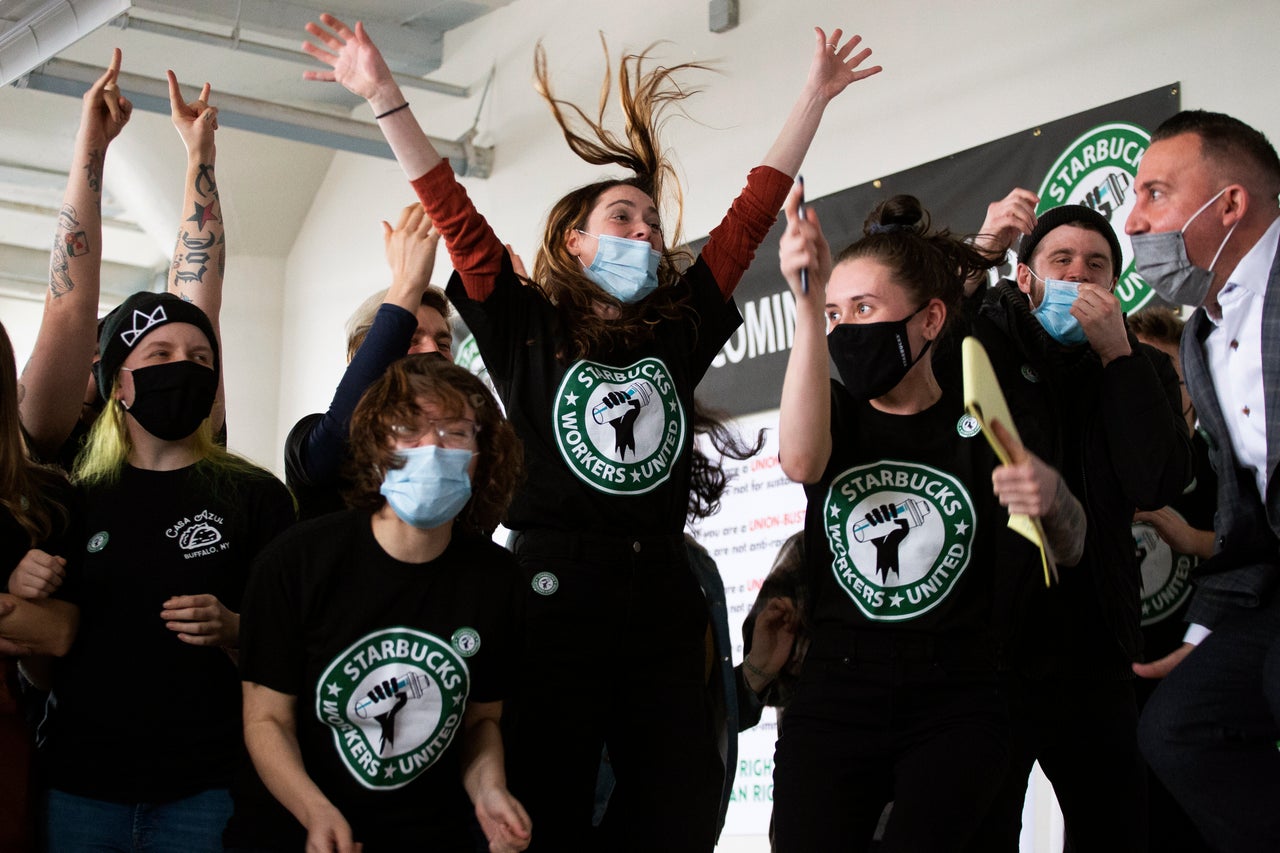 Starbucks employees and their supporters react to the votes from their union election on Dec. 9, 2021, in Buffalo, New York. The workers voted to unionize over the company’s objections, pointing the way to a new labor model for the 50-year old coffee giant. 