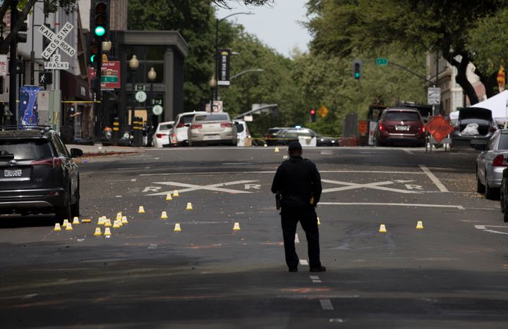 SACRAMENTO, CALIFORNIA - APRIL 03: A police officer works at the scene of a mass shooting on April 3, 2022 in Sacramento, California. Six adults were killed and 12 other people were injured in a mass shooting occurred early morning on Sunday in Sacramento, Xinhua News Agency reported. (Photo by Liu Guanguan/China News Service via Getty Images)