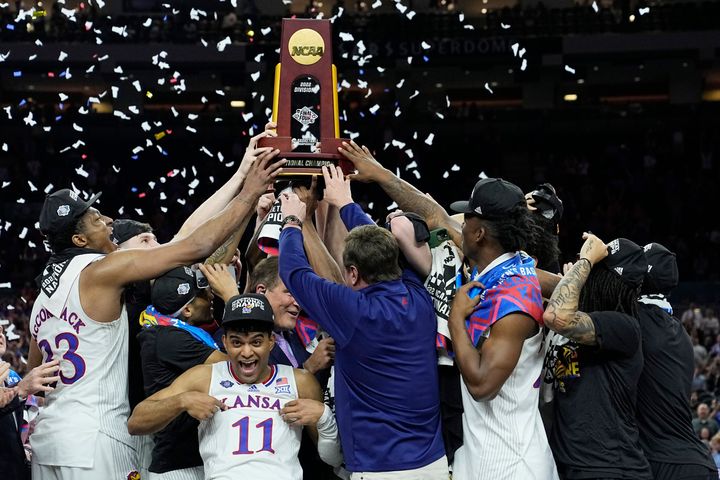 Kansas celebrates with the trophy after their win against North Carolina on Monday in New Orleans.