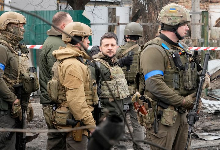 Ukrainian President Volodymyr Zelenskyy examines the site of a recent battle in Bucha, close to Kyiv, Ukraine, on April 4, 2022.