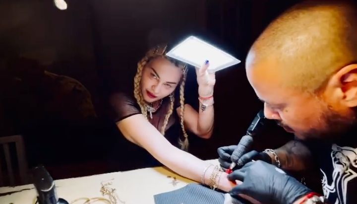 Madonna shared a clip of herself going under the needle for the fifth time