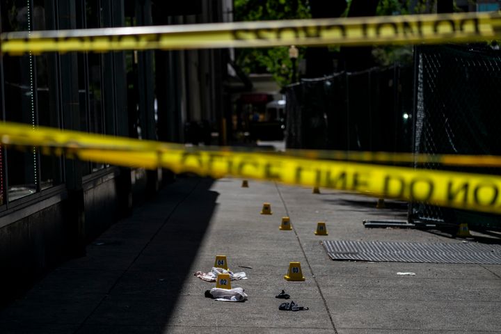 The crime scene at 10th Street and J Street in downtown Sacramento where 6 people were shot and killed, and 10 injured, at 2 am Saturday night in Sacramento, California Sunday April 3, 2022.