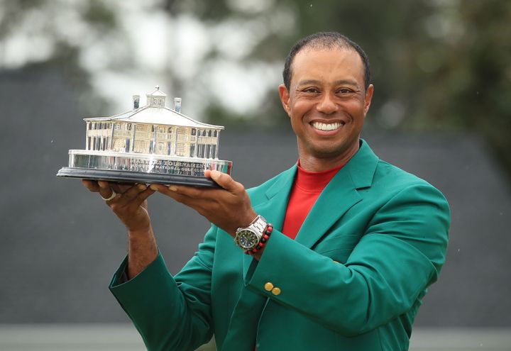 Woods celebrates during the Green Jacket Ceremony after winning the Masters at Augusta National Golf Club on April 14, 2019 in Augusta, Georgia.