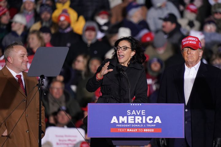 Katie Arrington, center, speaks at a Trump rally in South Carolina as former President Donald Trump looks on. She is running as a conservative who is more loyal to Trump than Mace.