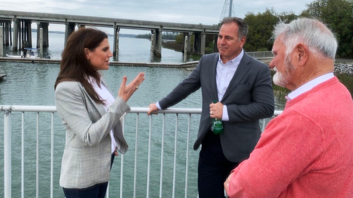 Rep. Nancy Mace (R-S.C.), left, discusses infrastructure issues with Hilton Head Island Town Manager Marc Orlando, center, and Mayor John McCann. McCann said he plans to vote for her.