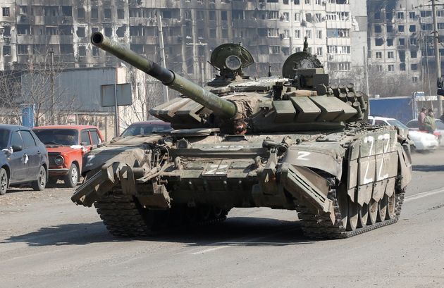 A tank of pro-Russian troops drives through Mariupol, Ukraine on April 5.