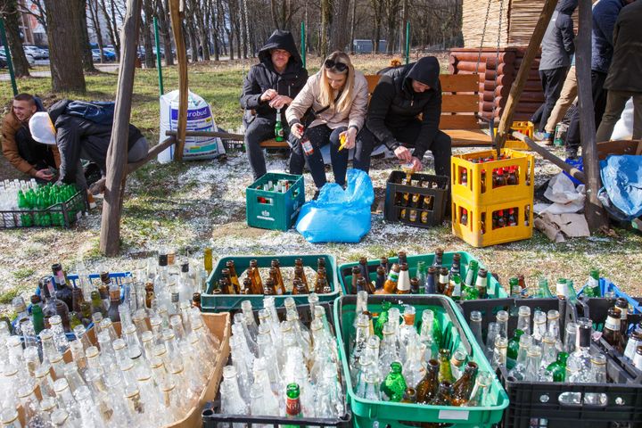 Across Ukraine, civilians like those seen here have learned how to make Molotov cocktails to defend their towns and cities.