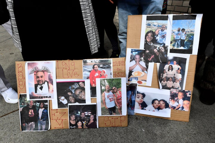 Photographs of De'vazia Turner are on display as his mother Penelope Scott speaks to the media during an interview at the corner of 10th and K street in Sacramento, Calif., on April 4, 2022.