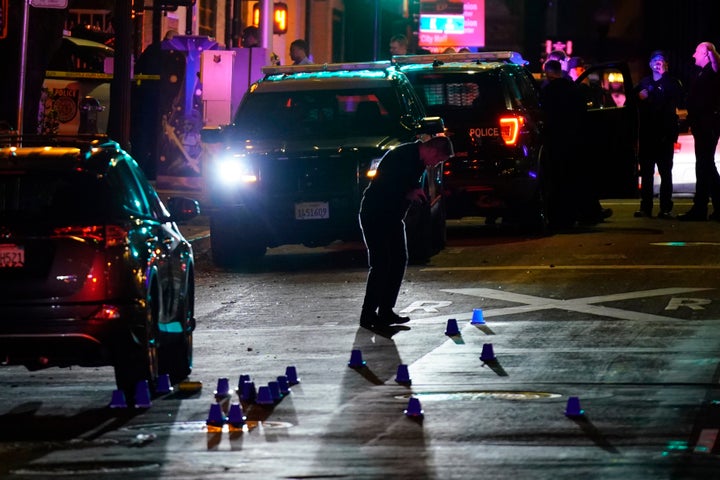 Investigators search for evidence in the area of a mass shooting In Sacramento, Calif. on April 3, 2022.