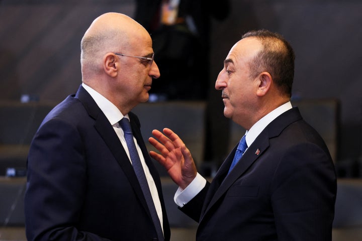 Greek Foreign Minister Nikos Dendias and Turkish Foreign Minister Mevlut Cavusoglu attend a NATO foreign ministers meeting, amid Russia's invasion of Ukraine, at NATO headquarters in Brussels, Belgium April 7, 2022. REUTERS/Evelyn Hockstein/Pool