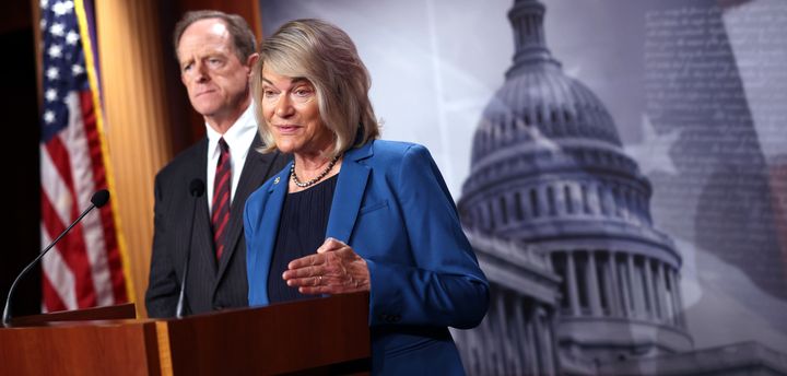 Sen. Cynthia Lummis (R-Wyo.), joined by Sen. Pat Toomey (R-Pa.), speaks on a cryptocurrency amendment to the bipartisan infrastructure bill, at the U.S. Capitol on Aug. 9, 2021, in Washington, D.C.