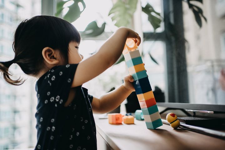 Matching objects, knocking things over and engaging in parallel play are some of the many interesting milestones in a child's development.