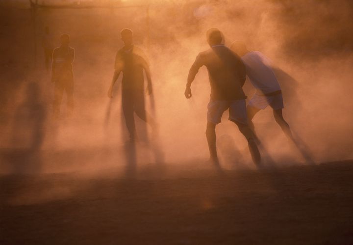 Road to Ouearz, a soccer match at sunset