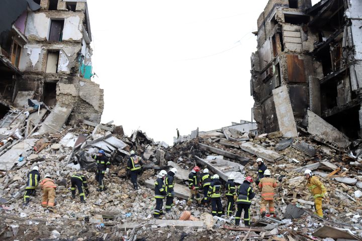 Rescuers clear debris at the site of a multi-story residential building destroyed by the russian army shelling, Borodyanka, Kyiv Region, western Ukraine.
