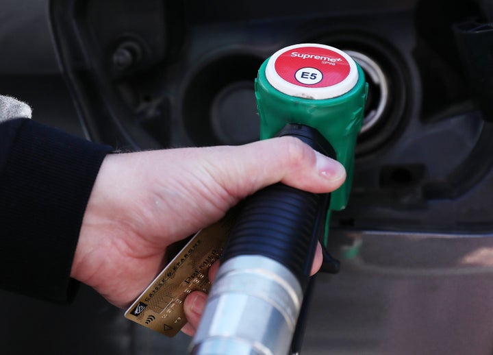 A customer fills the tank of his car at a gas station in Paris, France, Oct. 22, 2021.