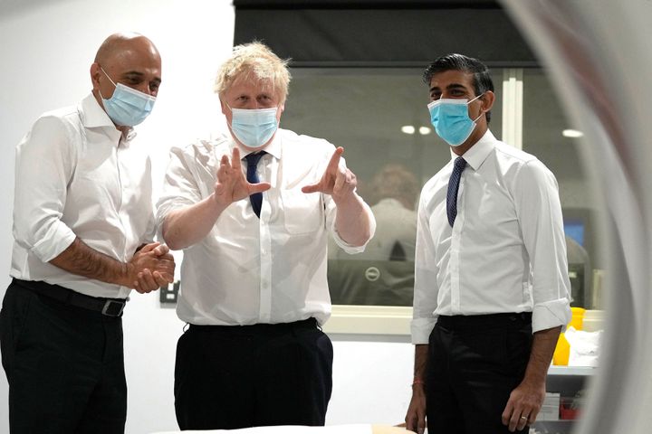 Sajid Javid, Boris Johnson and Rishi Sunak on a visit to the New Queen Elizabeth II Hospital in Welwyn Garden City, north of London on April 6, 2022. 