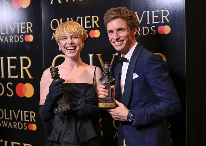 Jessie Buckley, winner of the Best Actress in a Musical award for Cabaret, and Eddie Redmayne, winner of the Best Actor in a Musical award for Cabaretin the winner's room during The Olivier Awards 2022.