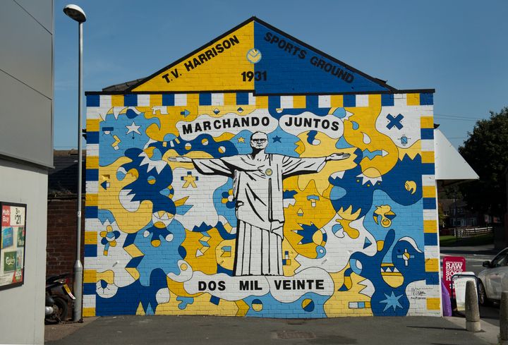 A mural of Marcelo Bielsa, the Leeds United manager, in the pose of the Christ the Redeemer statue in Rio de Janeiro in Brazil. Painted by Burley Banksy and Nicholas Dixon on the side of the Pet Lodge Superstore in Oldfield Lane, Leeds