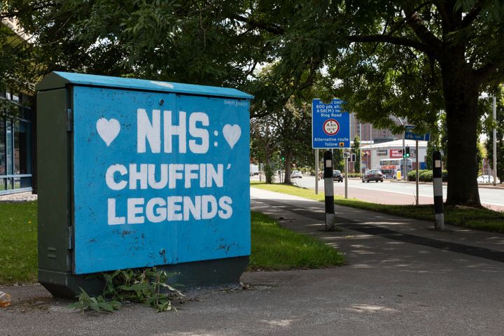 A BT box with graffiti art celebrating the NHS and its efforts to combat Covid-19 by Burley Banksy