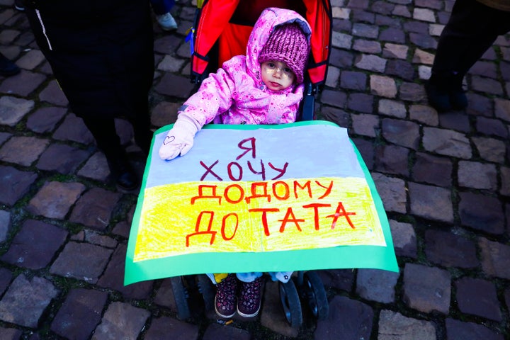 KRAKOW, POLAND - APRIL 10 : A child attends 'Mothers' March' as part of Stand with Ukraine international protest, in Krakow, Poland on April 10, 2022. Ukrainian mothers and supporters gathered to demonstrate solidarity with all victims of Russian attacks on Ukraine. (Photo by Beata Zawrzel/Anadolu Agency via Getty Images)