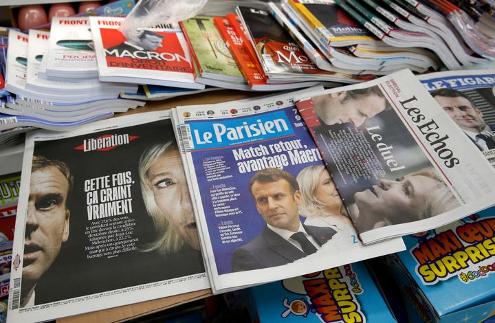 The front pages of the French newspapers, Le Figaro, Liberation are displayed in a newsstand with the photos of Emmanuel Macron and Marine Le Pen the day after the first round of the presidential elections.
