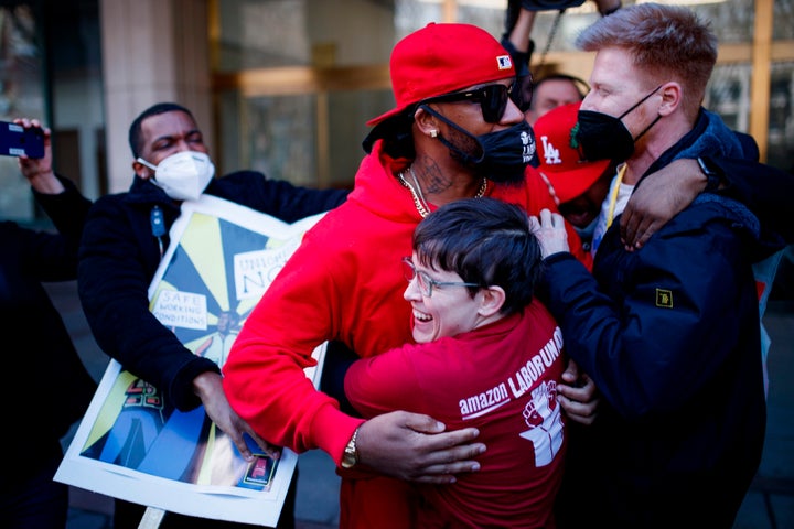 Amazon Labor Union President Christian Smalls (in red hoodie) hugs fellow organizers after the final unionization votes were counted on April 1. Smalls has endorsed Brittany Ramos-DeBarros for Congress.