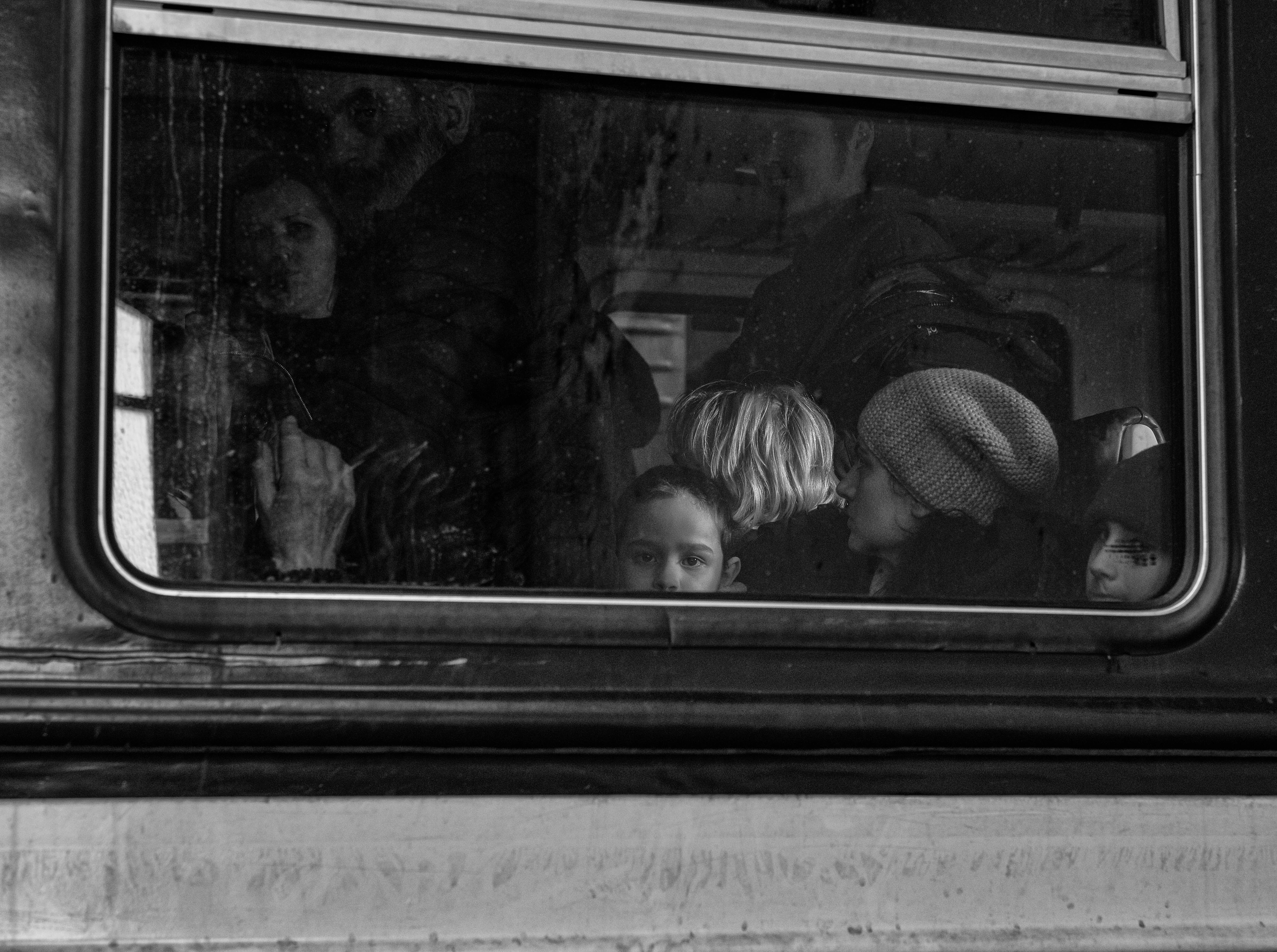 Ukrainian refugees aboard a train bound for Poland at Lviv-Holovnyi railway station.