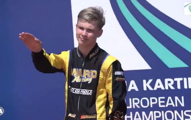 Russian driver Artem Severiukhin made a meaningful gesture on the podium of a kart race,...