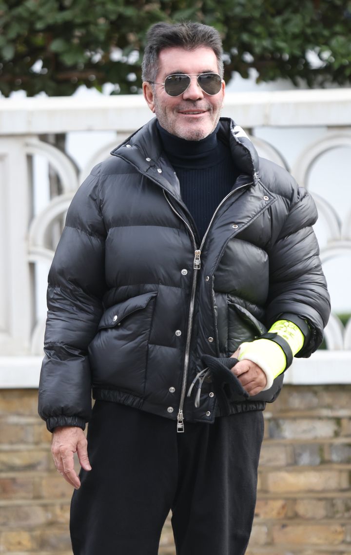 Simon leaves his house in London's Holland Park with a broken arm after suffering another bicycle injury earlier this year.