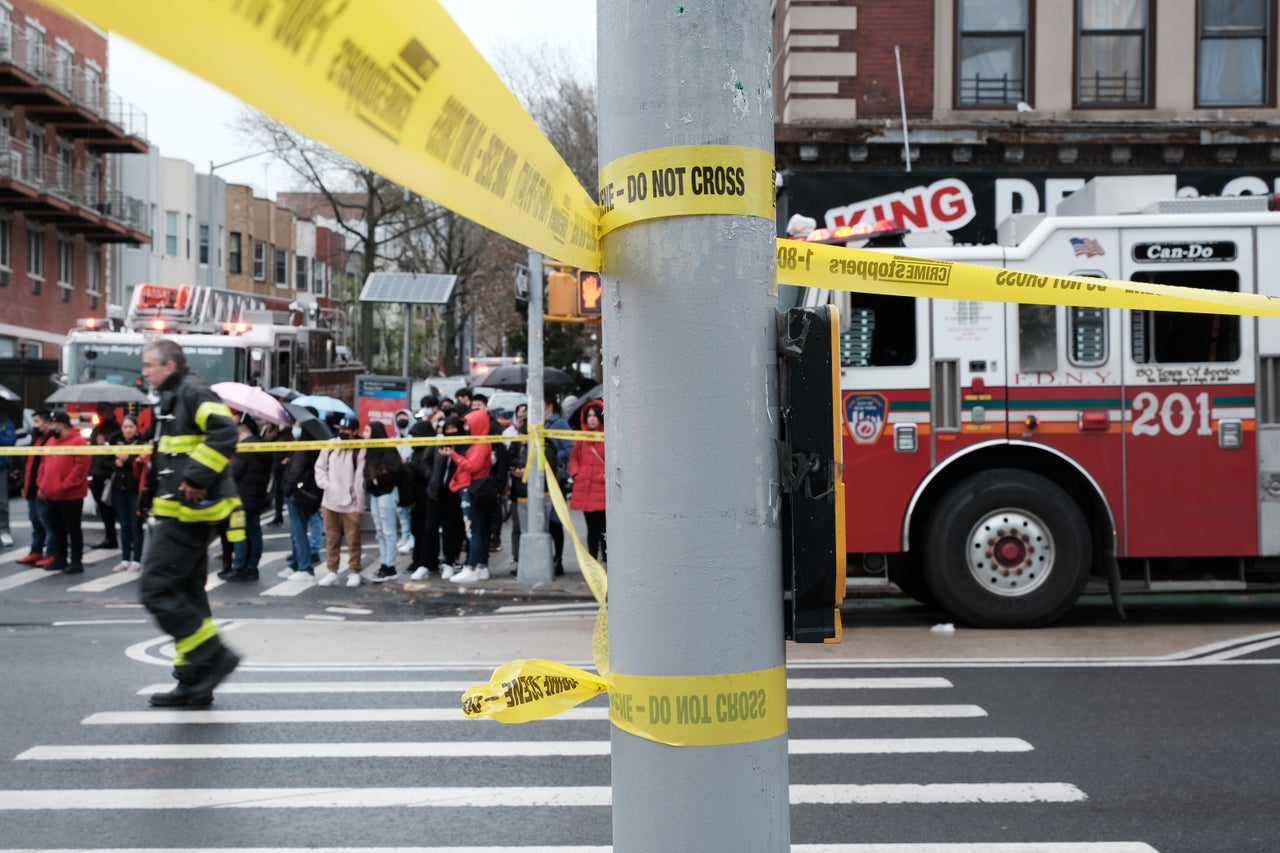 Police and emergency responders outside of the 36th St. subway station.