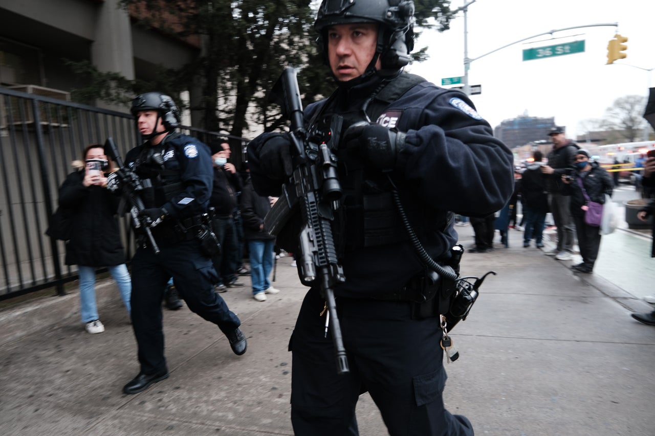 Police and emergency responders rush to the scene.