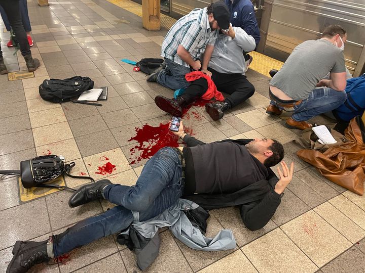 New Yorkers on their way to work help treat victims of the shooting on the Manhattan-bound platform of the 36th Street station.
